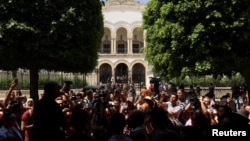 Journalists protest outside the Palace of Justice, during the trial of detained IFM radio journalists Mourad Zghidi and Borhen Bsaiss, in Tunis, Tunisia, May 22, 2024. 