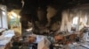 A classroom is littered with debris at a school hit by a Russian air bomb in Kharkiv, Ukraine, March 23, 2022.