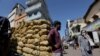 A man stands by a cart with potatoes at a market, amid the country's economic crisis in Colombo, Sri Lanka, April 7, 2022.