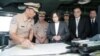 In this image from the Taiwan Presidential Office, Taiwan's President Tsai Ing-wen (center) reviews nautical charts aboard a Taiwan Navy ship before it sets out to patrol in the South China Sea from the naval base in the southern port city of Khaohsiung, Taiwan.