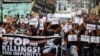 Protesters and supporters carry banners and placards as they march with the hearse of slain Kian Loyd Delos Santos, a 17-year-old student, during his funeral, Aug. 26, 2017, in suburban Caloocan city north of Manila, Philippines. The killing of Kian has sparked an outcry against President Rodrigo Duterte's anti-drug crackdown.