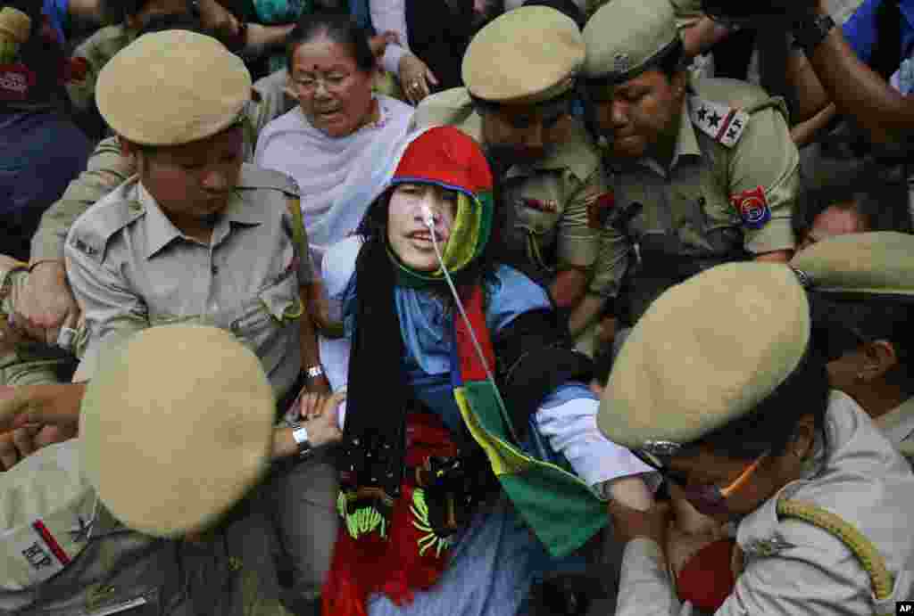 Activist Irom Sharmila is taken back to a hospital after a court appearance in Imphal, in the north-eastern state of Manipur, India. The 44-year-old activist, who has been on a hunger strike for nearly 16 years to protest against alleged brutality by India's military, ended her fast today.