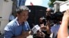 A Taiwanese citizen identified only as "William" speaks with the media outside the Taiwan embassy, Aug. 21, 2018.