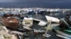 Des épaves de bateaux utilisés par les migrants échouées le long du port d'El-Amra, en Tunisie, 24 avril 2024. Fethi Belaid / AFP