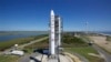 This image provided by NASA shows the Lunar Atmosphere and Dust Environment Explorer aboard a Minotaur V rocket after a rollout at NASA's Wallops Island test flight facility in Wallops Island, Va., Sept. 5, 2013.