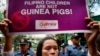 A woman displays a placard during a rally outside the Department of Health to protest the administration of the anti-Dengue vaccine Dengvaxia which was developed by Sanofi Pasteur, Feb. 7, 2018, in Manila, Philippines.