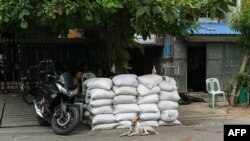မန္တလေးမြို့ စစ်ဆေးရေးဂိတ်တခု (ယခင်မှတ်တမ်းဓာတ်ပုံ)