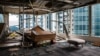 Panels and debris from a collapsed ceiling are seen with blown over pieces of furniture in a company office, in a harbourside commercial building, whose windows were blown out the day before during Typhoon Mangkhut in Hong Kong on September 17, 2018.